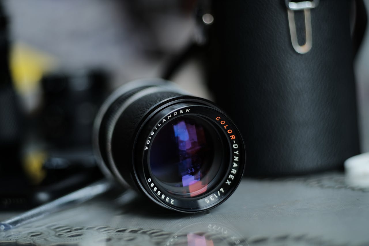 Voigtlander camera lens with selective focus and blurred background.